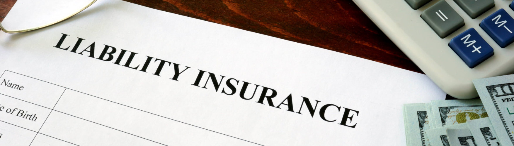 liability insurance form and dollars on the table